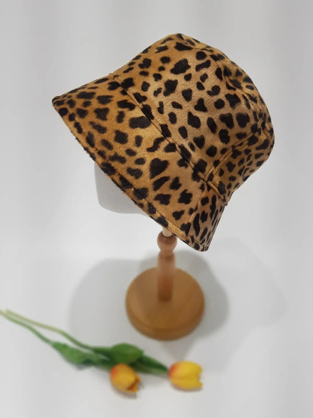 Leopard print big cat-bucket hat on display. Stylish, eye-catching pattern and classic bucket hat shape.