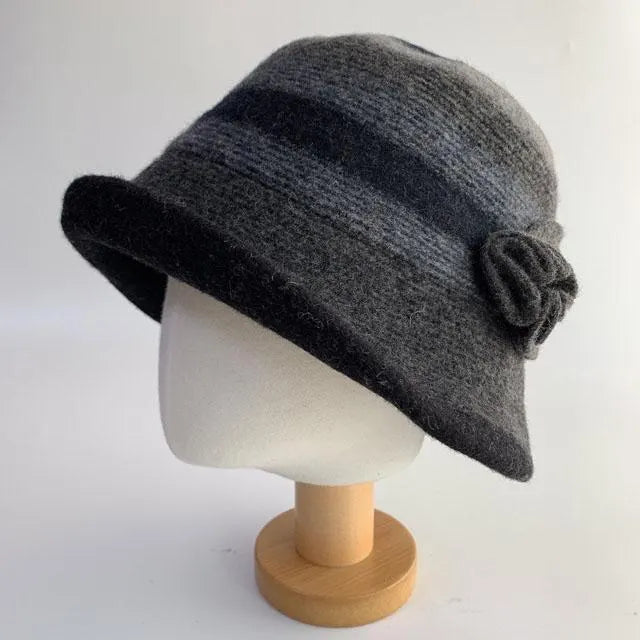 Grey wool classic wool bucket hat with a dark band and a decorative flower detail on the side.