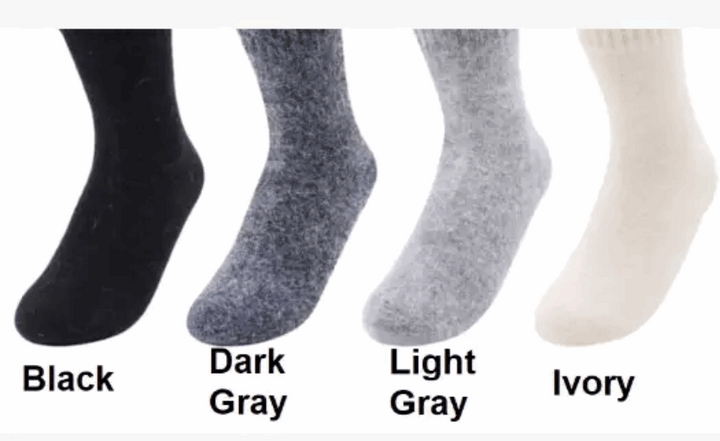 Four pairs of socks in black, dark gray, light gray, and ivory on a white background.
