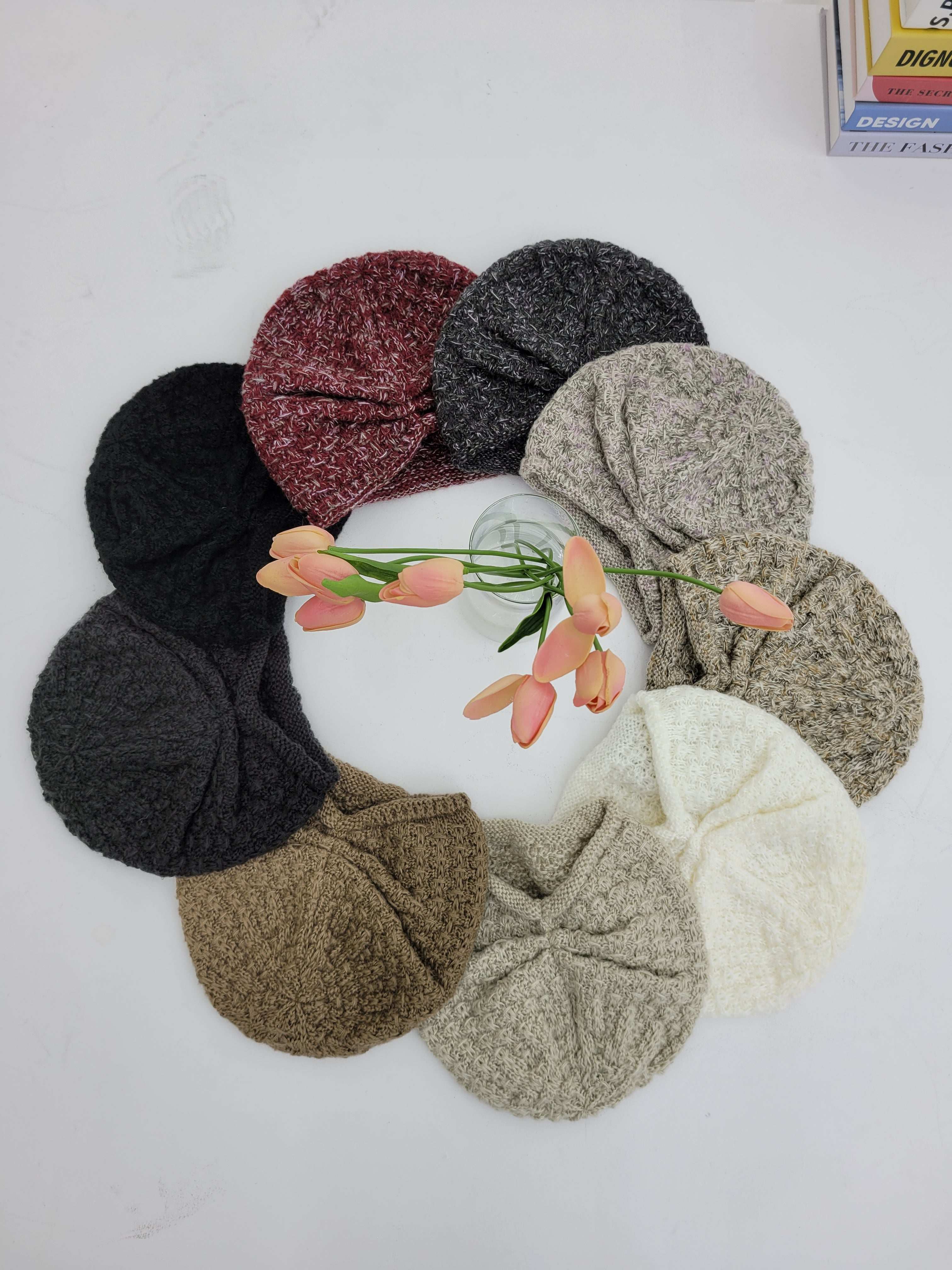 Collection of colorful headbands arranged around a ball with flowers on a white background