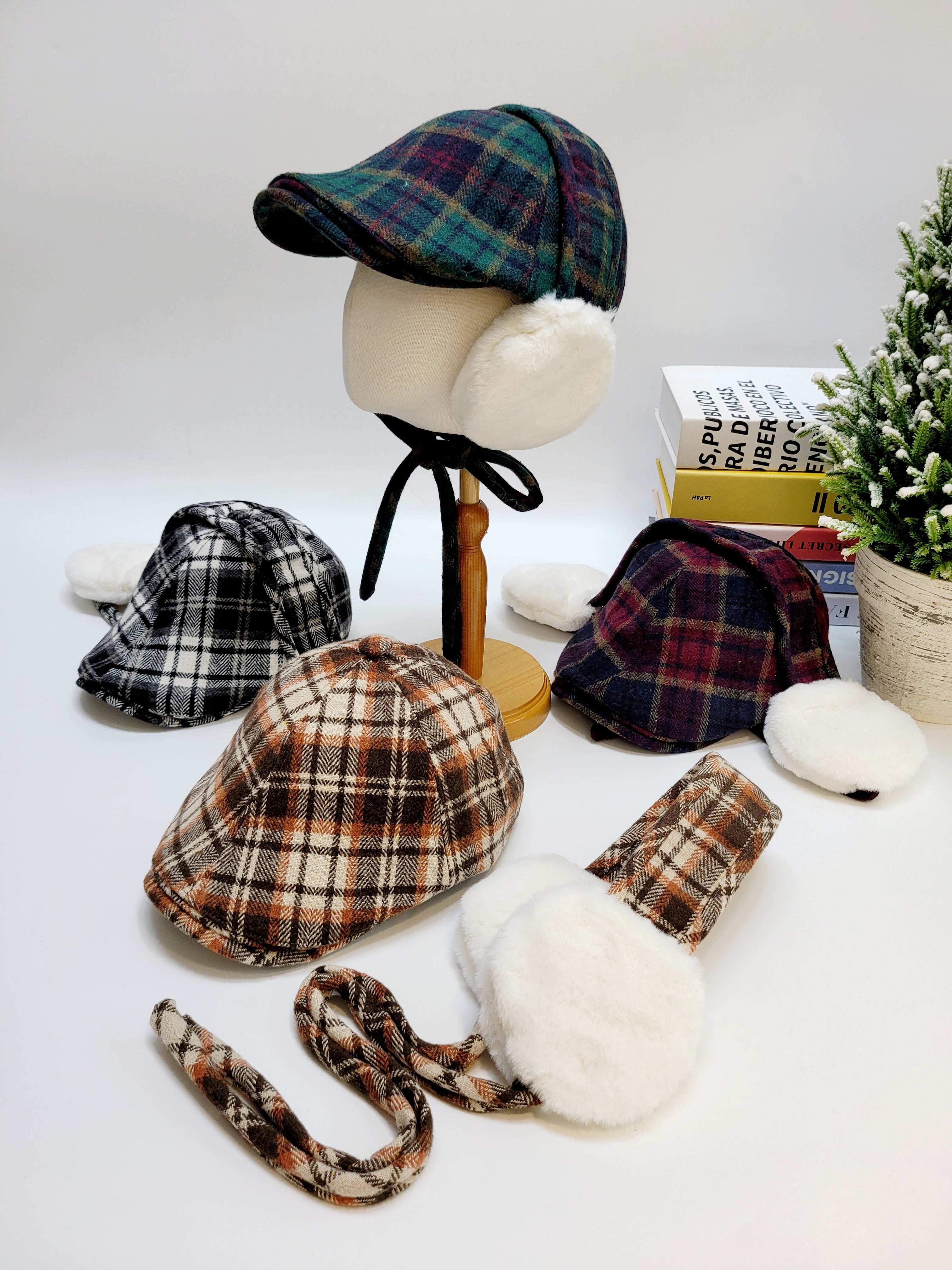 Plaid hats on a mannequin head with a white background