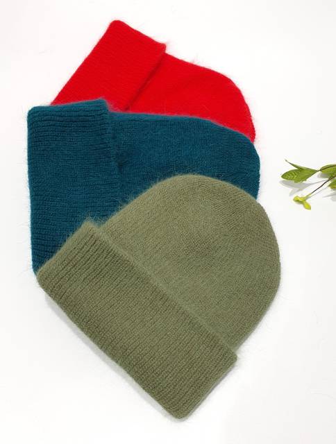 Three knit beanies in red, blue, and gray on a white background