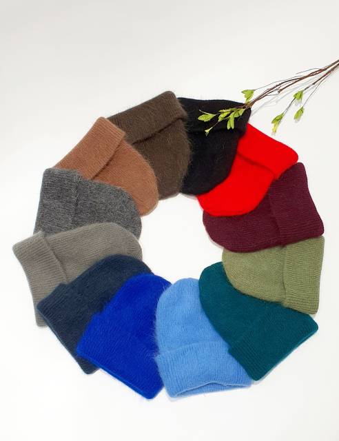 Ring of colorful folded socks on a white background