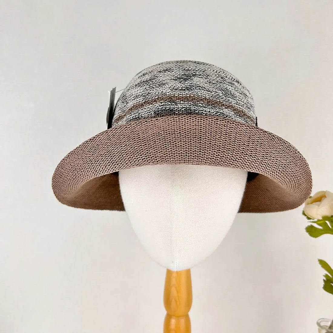 Stylish sun hat with a brown woven brim and a gray, white, and brown patterned crown, offering breathable sun protection for women's summer fashion.