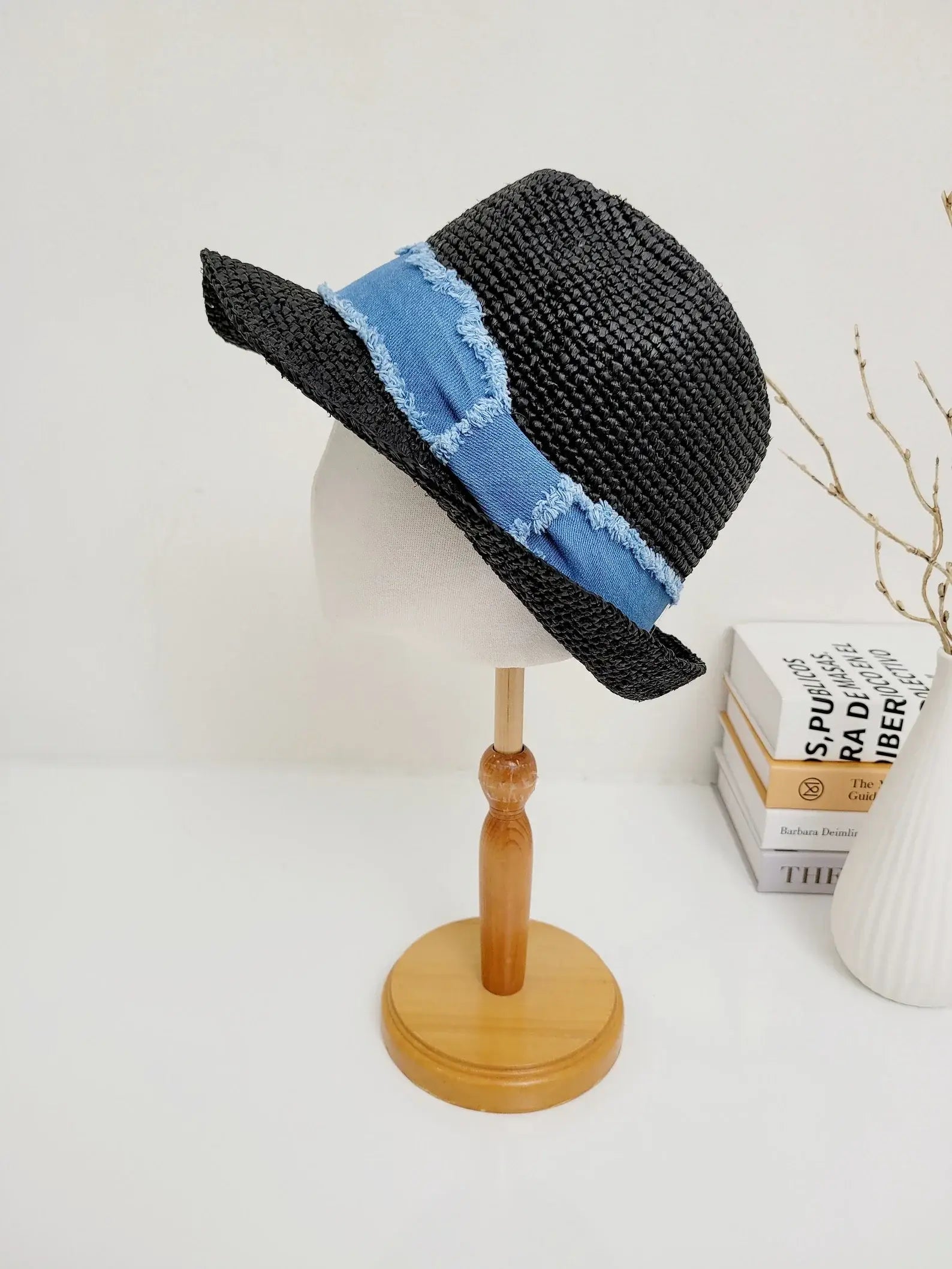 Black straw lic breeze fedora hat with a stylish blue denim ribbon accent, perfect for sun protection and a fashionable look.