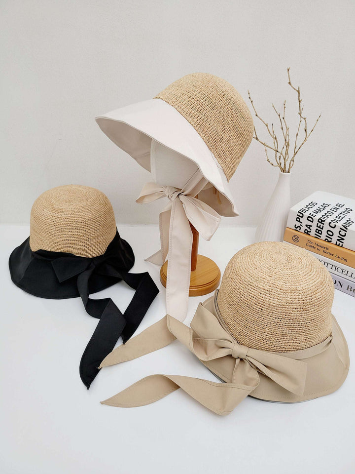Three south hampton straw sun hats: black, beige, and white brim variations with matching ribbon ties, offering stylish sun protection.