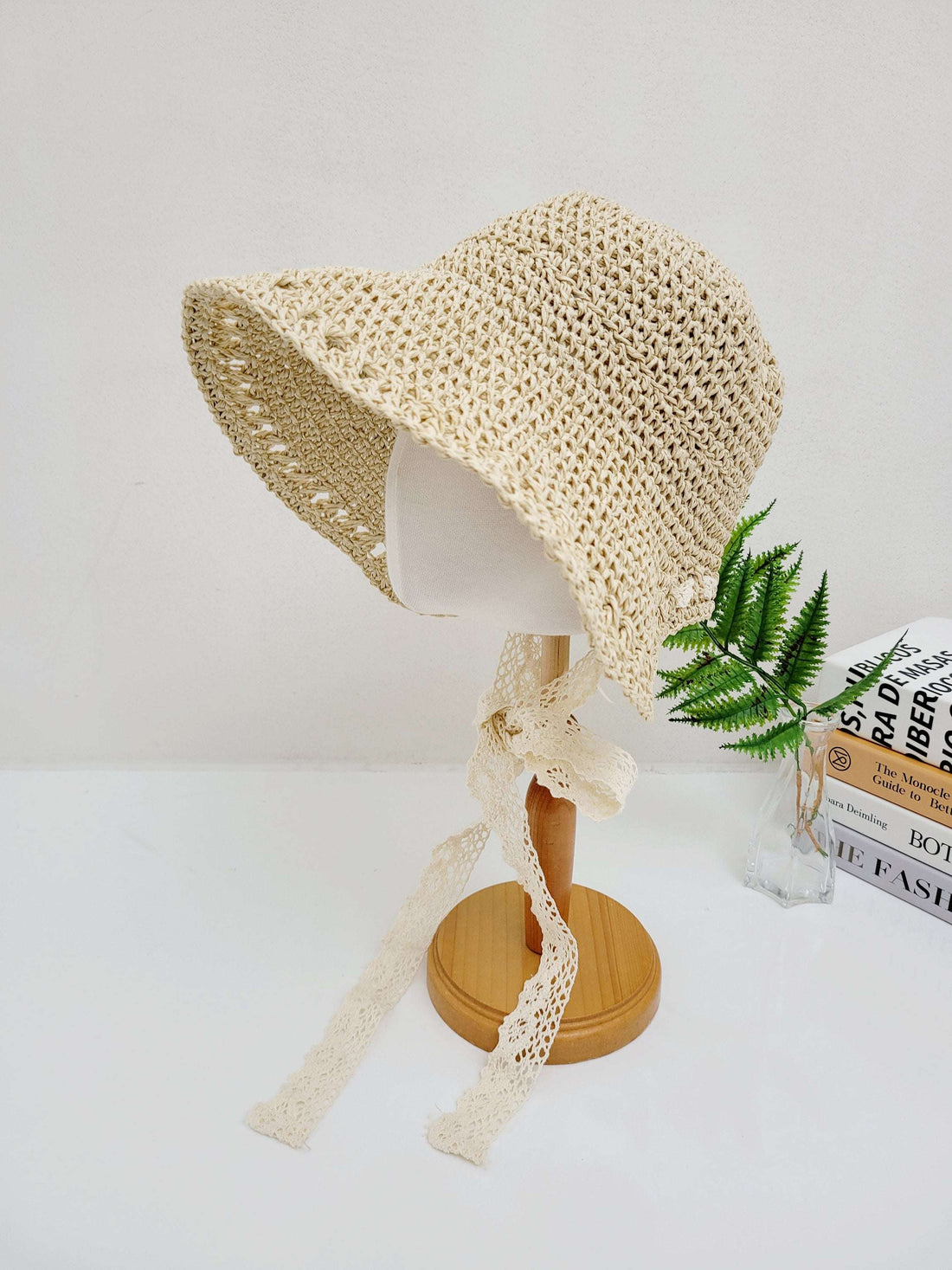 Bora Bora sun hat: woven straw hat with wide brim, lace ribbon tie, and light, airy design—perfect for sun protection and stylish flair.