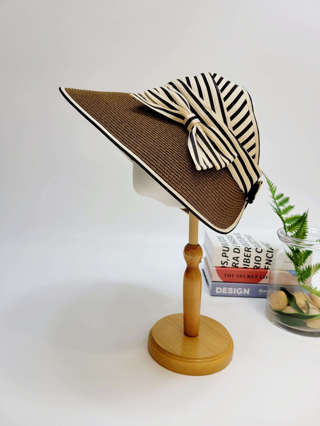 monroe brown sun hat with a chic black and white striped bow detail, offering stylish sun protection.