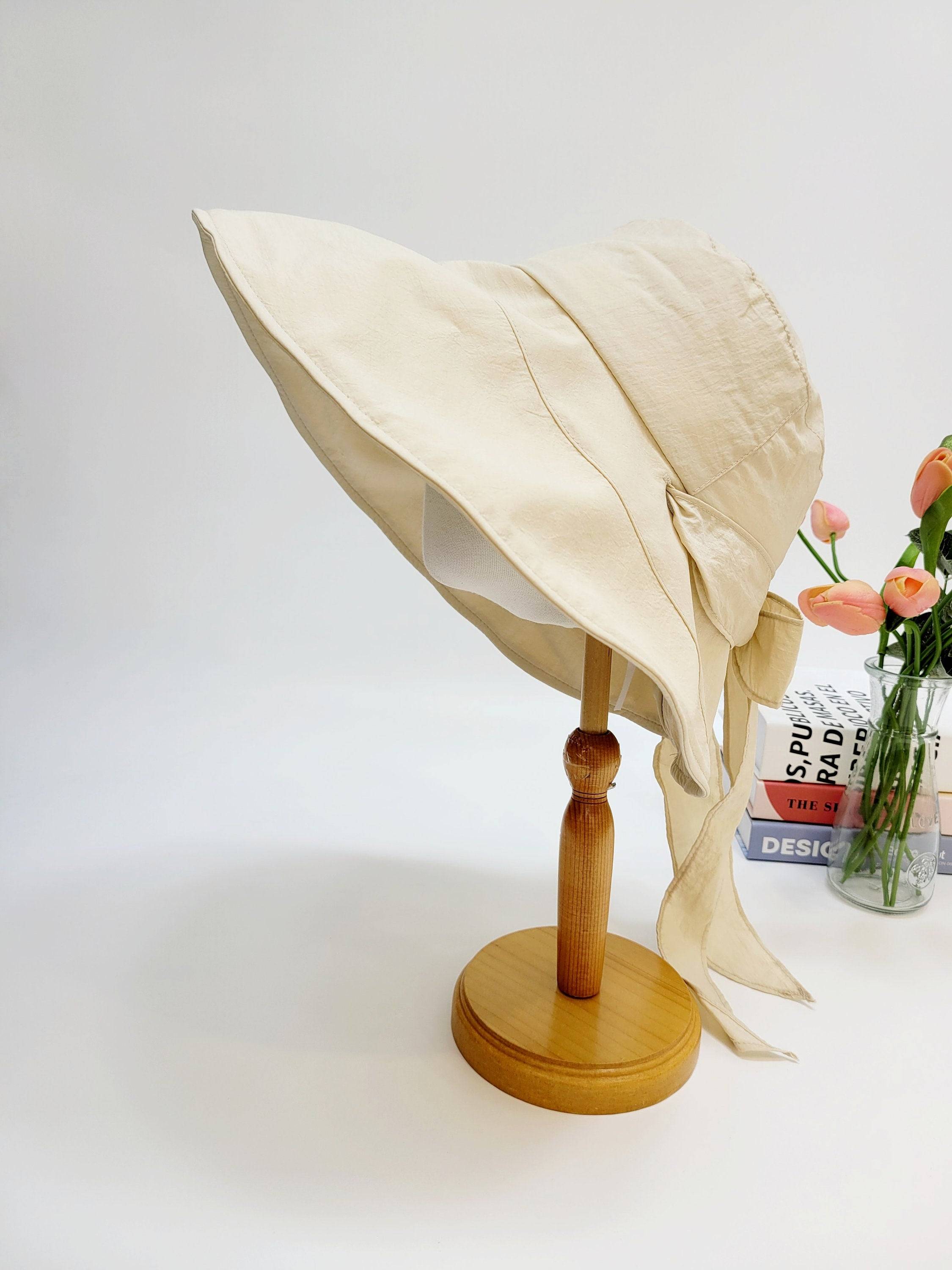 my fair lady beige sun hat with a wide brim and tie detail, perfect for summer and sun protection.