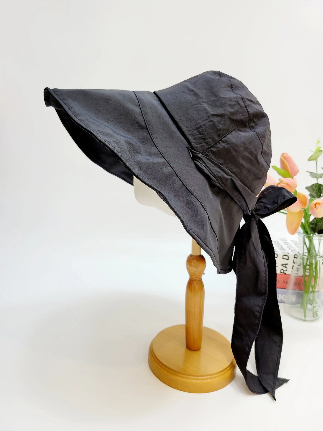 MY FAIR LADY black sun hat with a wide, floppy brim & elegant ribbon tie, offering stylish sun protection for summer days