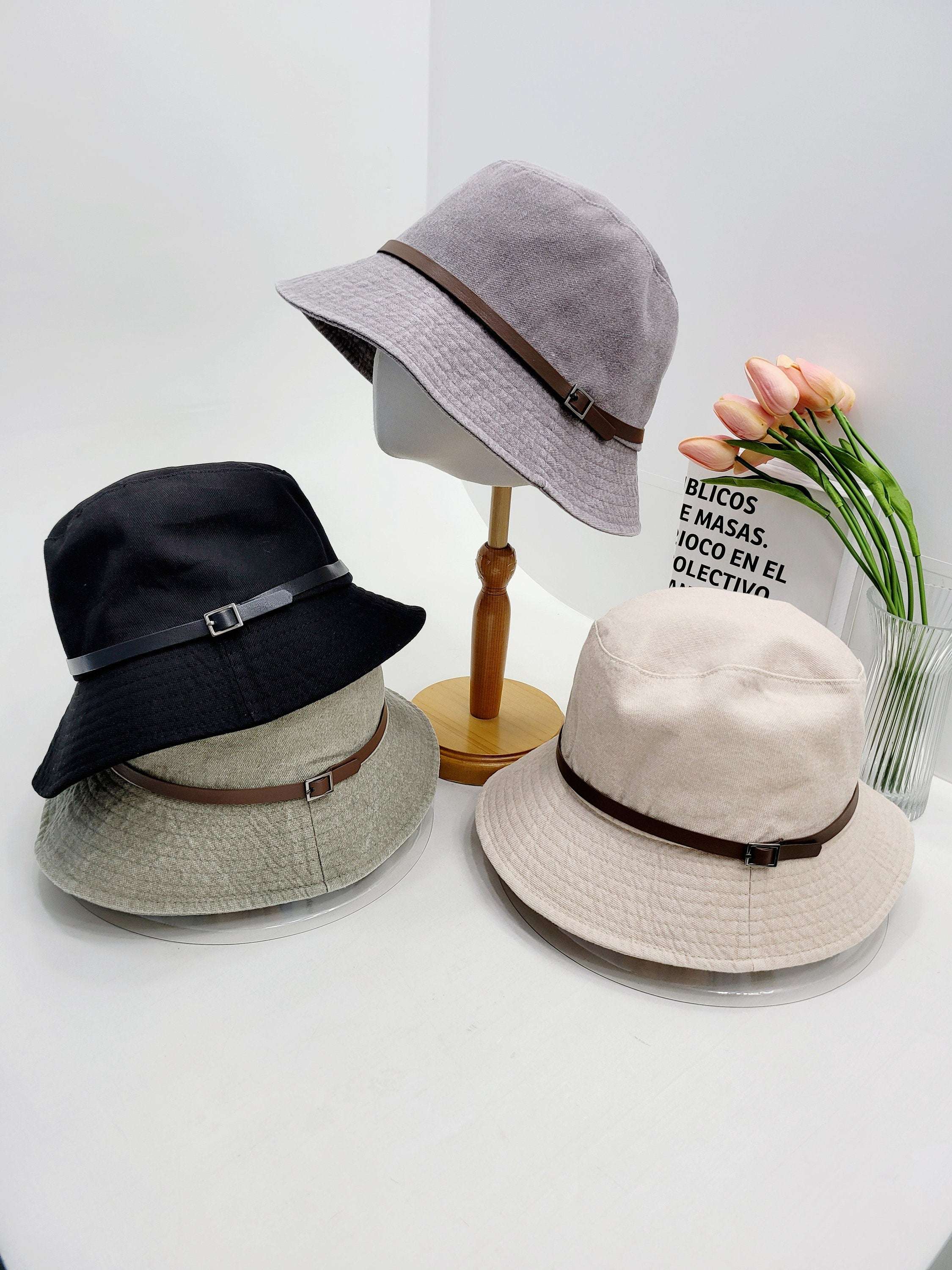 MILES bucket hats: black, grey, beige, olive green with faux leather band. Casual sun protection style.