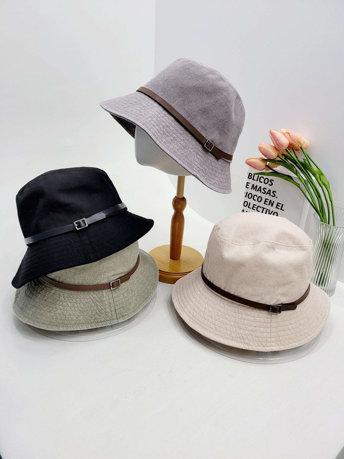 MILES bucket hats: black, grey, beige, olive green with faux leather band. Casual sun protection style.