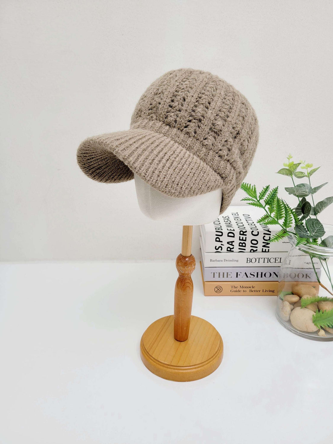Beige crochet - baseball cap on mannequin head. Knitted texture with visor detail.
