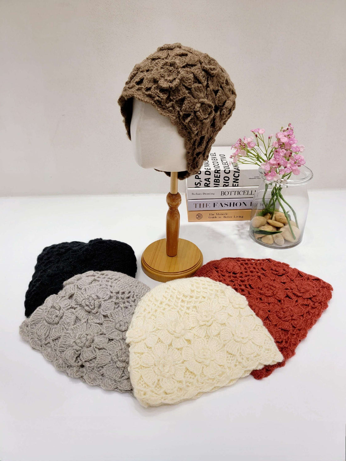 sharon beanie: Assorted crocheted beanies in brown, black, gray, cream, and rust. Each beanie features a unique floral pattern and soft, textured design.