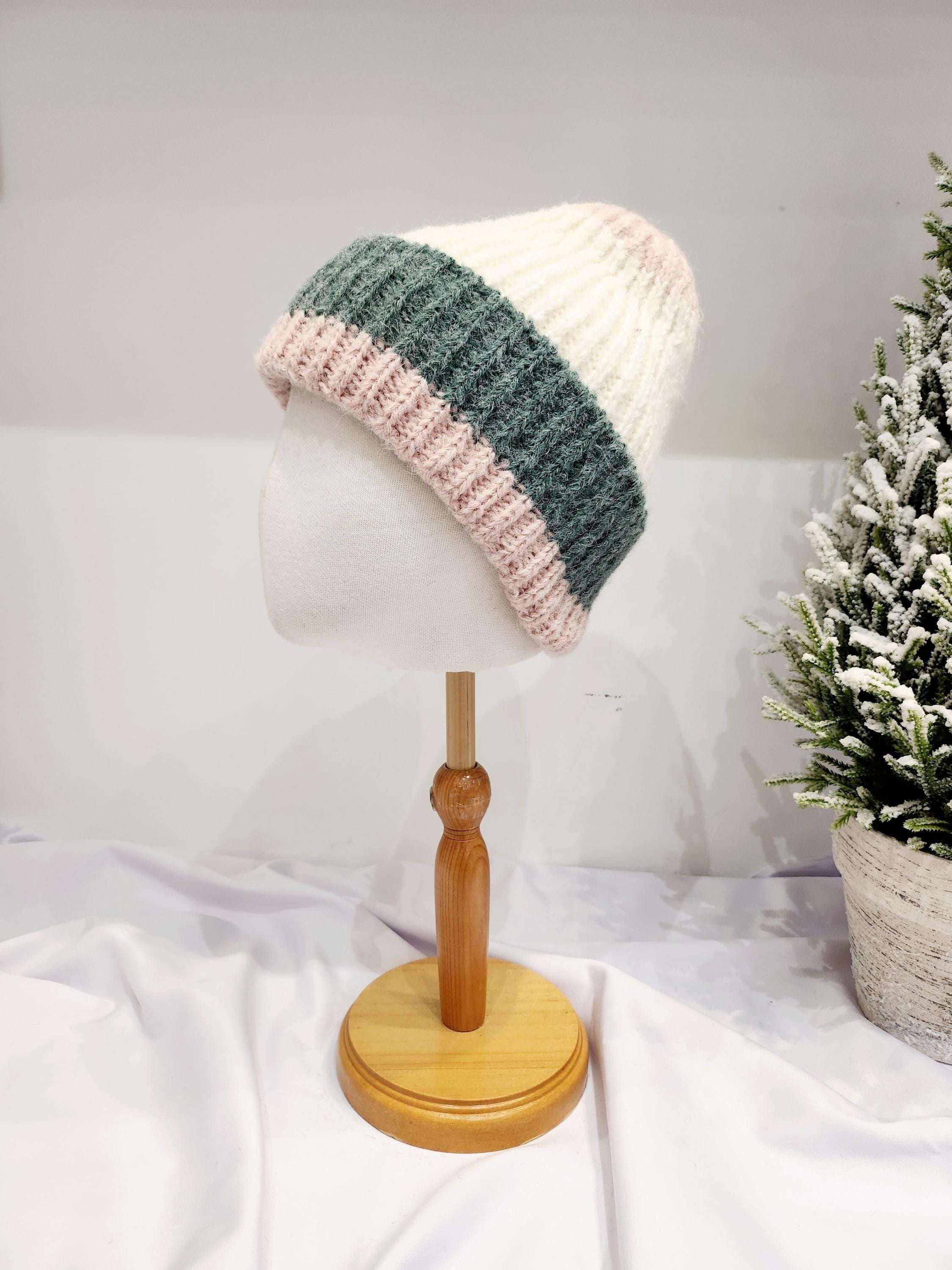 anna angora beanie: Cream, gray, and pink striped knit beanie on a mannequin head. Soft angora blend.