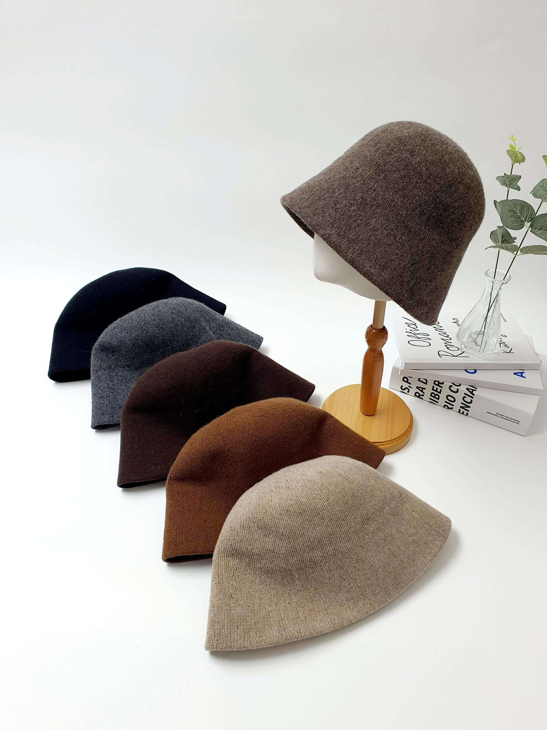FALL'IN WINTER wool bucket hats in neutral colors: black, gray, brown, beige. Warm, minimalist fall/winter hat options.