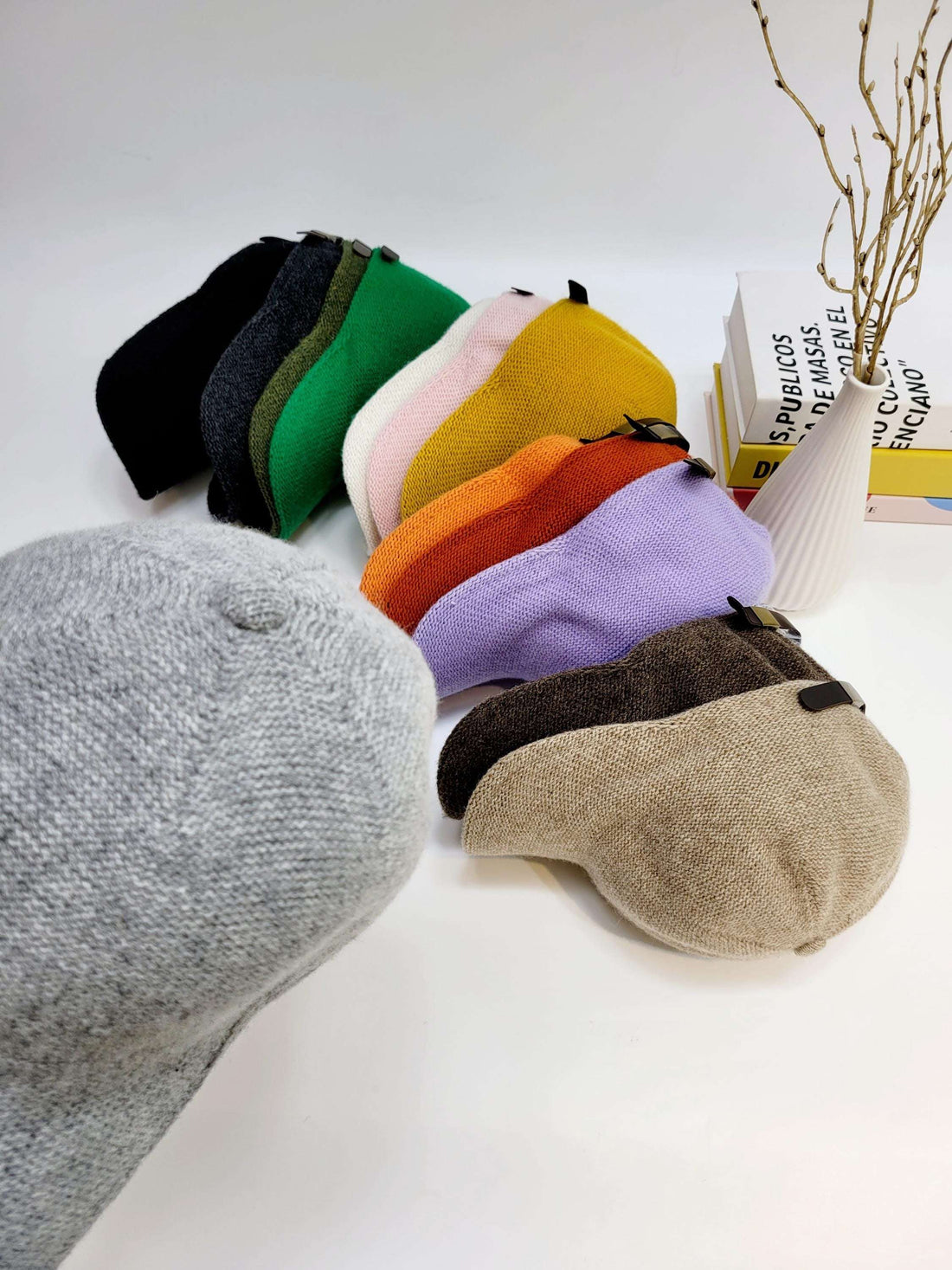 Wool cap collection: black, gray, green, pink, yellow, orange, purple, brown & beige. Cozy, stylish headwear for warmth and fashion.