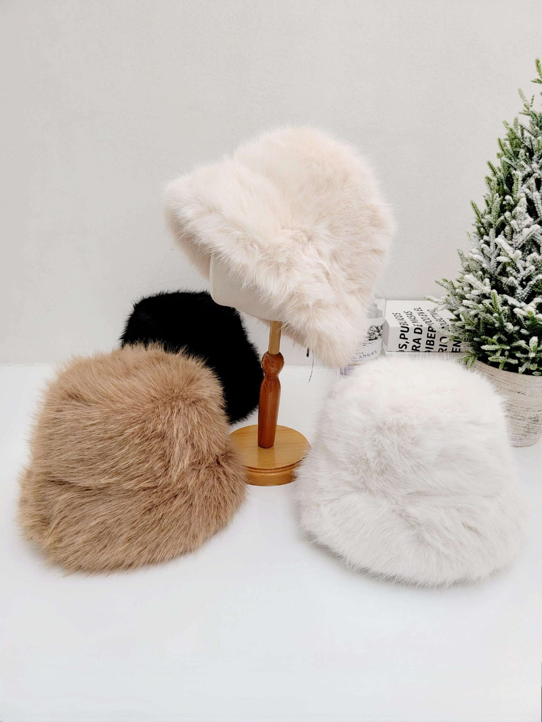 
FAKE FUR ANGELINA WINTER SPY hats in cream, brown, white, and black. Soft, plush faux fur bucket hats for winter warmth and style.
