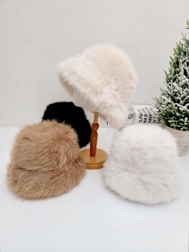 
FAKE FUR ANGELINA WINTER SPY hats in cream, brown, white, and black. Soft, plush faux fur bucket hats for winter warmth and style.
