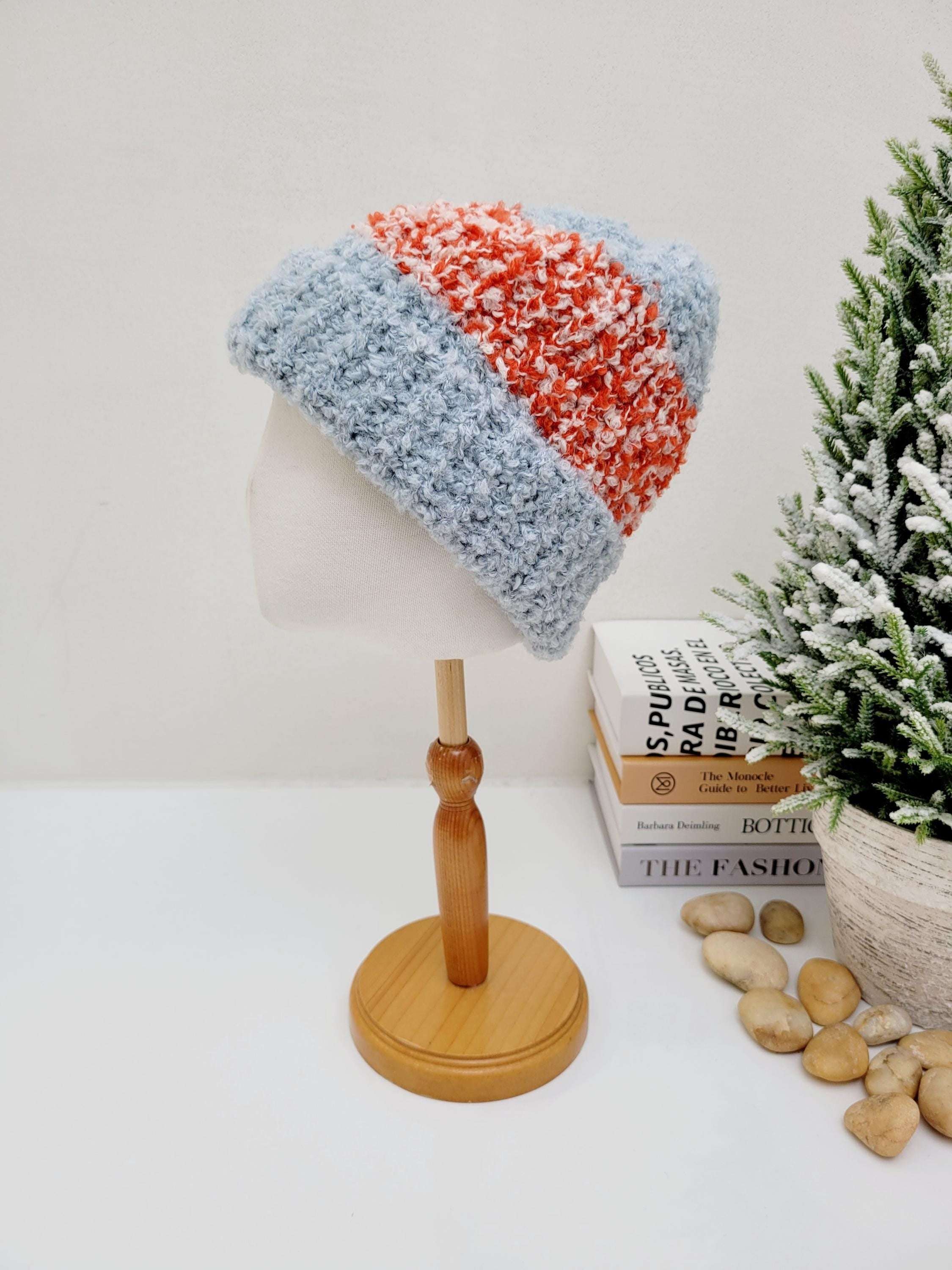 Two-tone tokyo beanie: a cozy, textured hat with light blue and orange-white sections, displayed on a mannequin head.