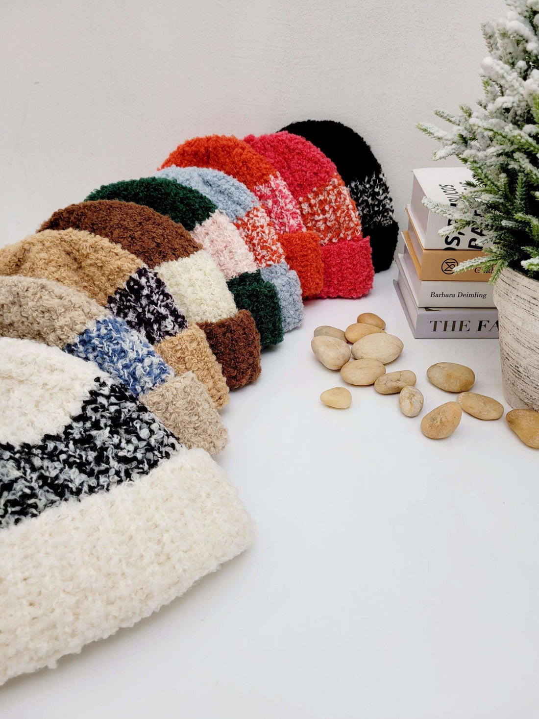 Assorted tokyo beanie - 2tone hats in a patchwork of textures and colors. Soft, cozy, and stylish winter headwear displayed with decorative books and stones.