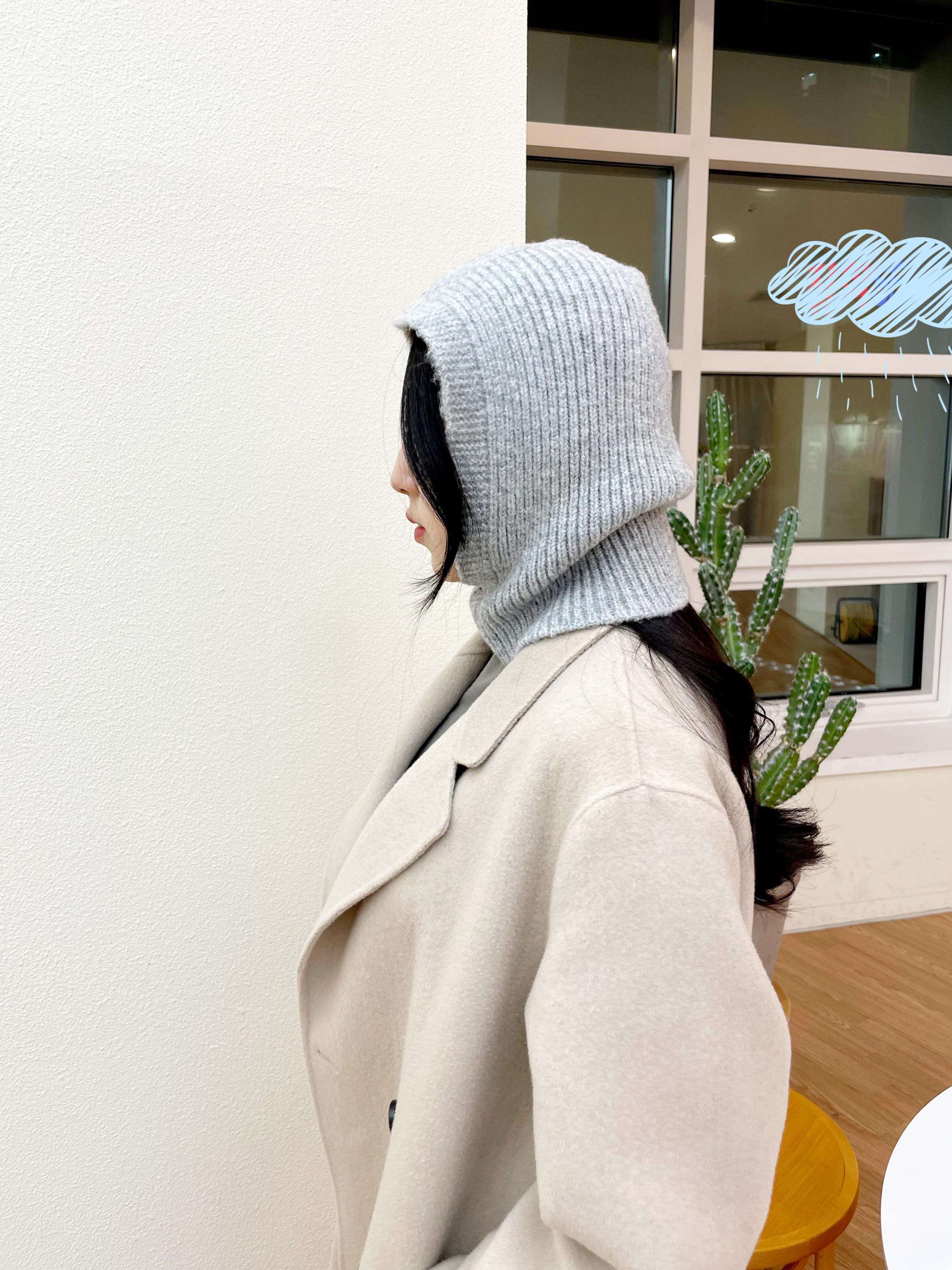 Light gray knit LITTLE RIDING HOOD - BALACLAVA paired with a cream coat, offering warmth and style.