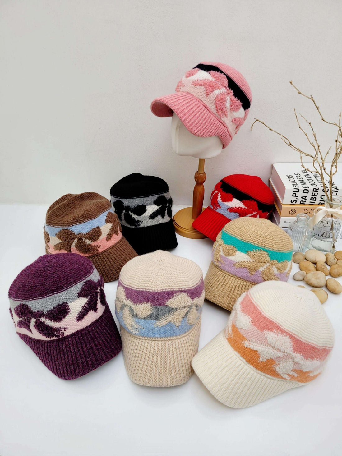 EARMUFF knitted wool cap collection: assorted colors, patterned brims, cozy warmth for winter style.
