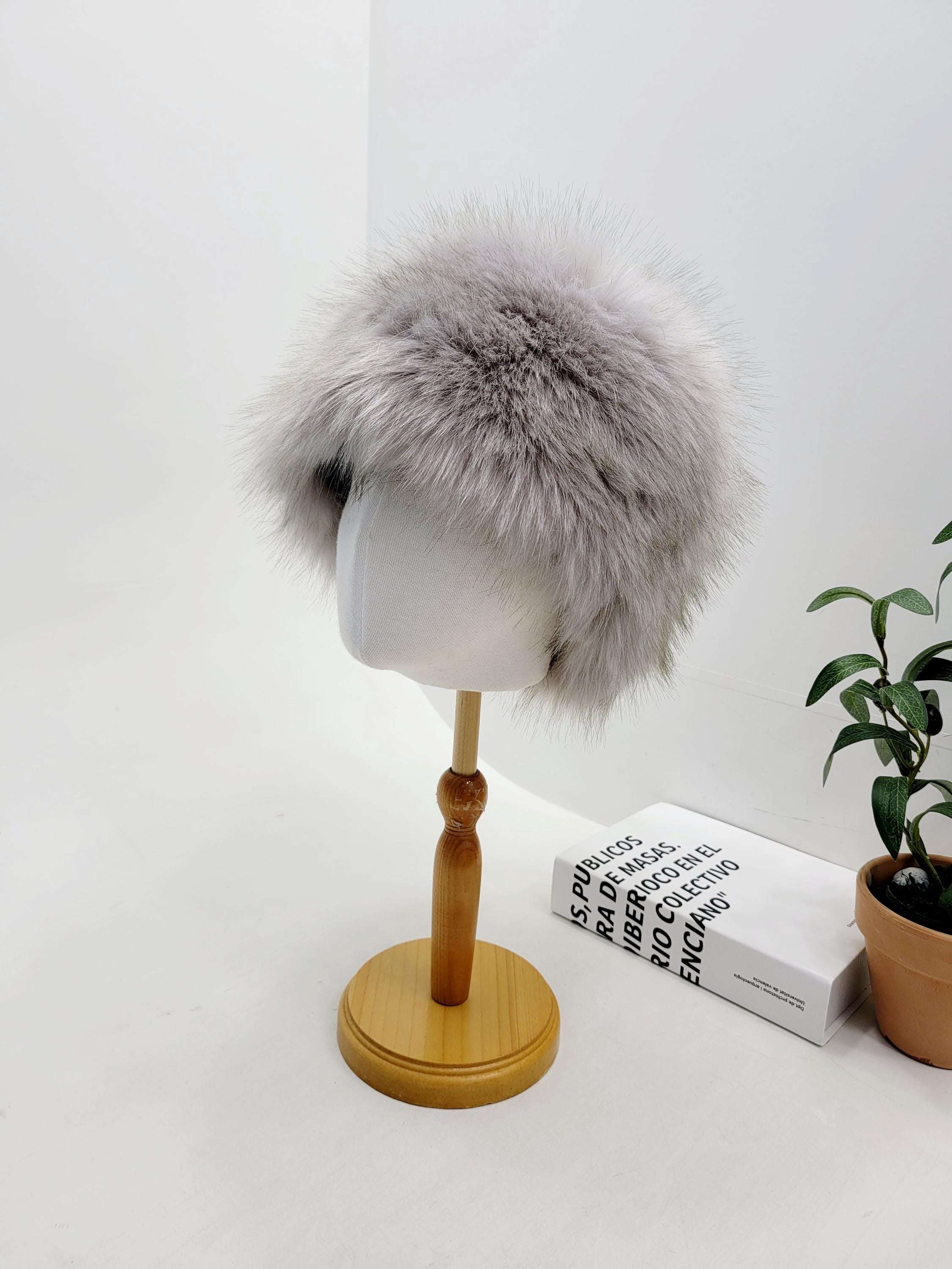 Fluffy gray Sonya Hat, a soft and stylish winter accessory displayed on a mannequin head.
