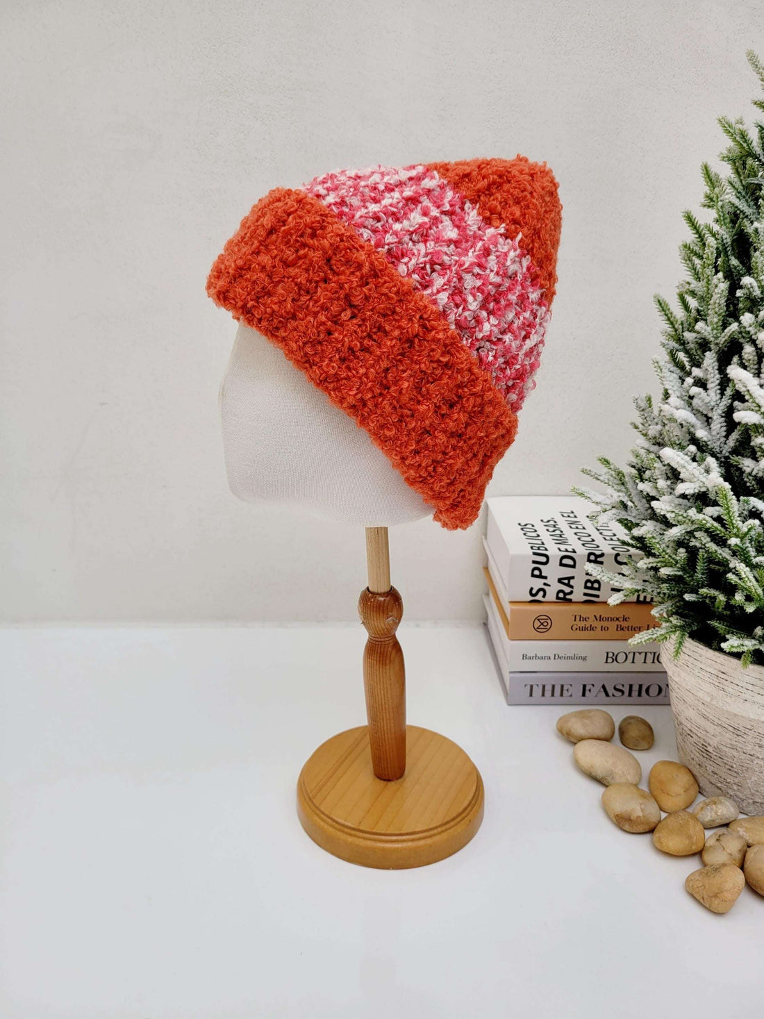 Handmade tokyo beanie - 2tone. A cozy crocheted hat with a fuzzy orange brim and a pink and white patterned crown, displayed on a mannequin head.