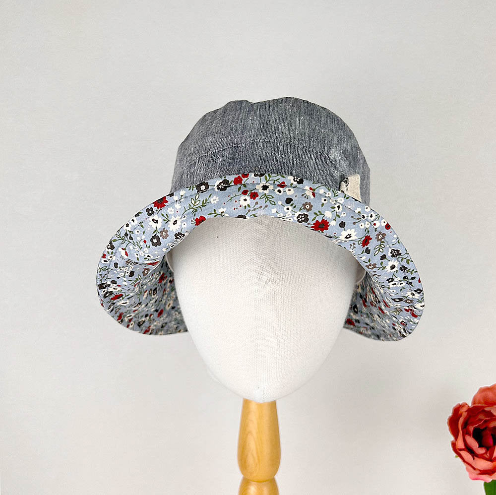 olivia's summer hat: denim blue baby/toddler sun hat with a floral print brim, perfect for summer