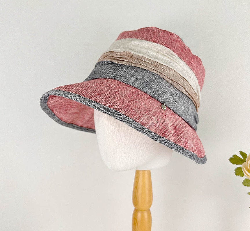 LIC summer breeze bucket hat: Red, gray, beige, and white linen hat with a brim, perfect for sun protection and a stylish look.
