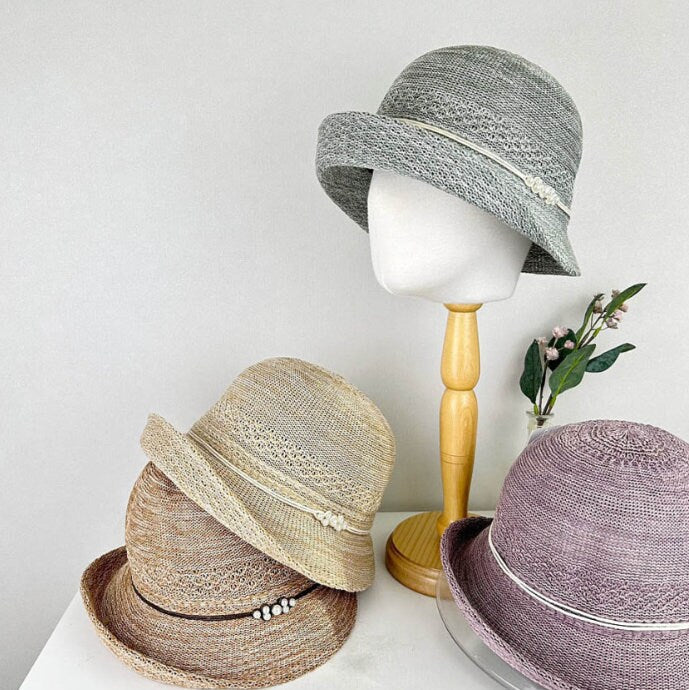 alexandra sun hats: woven hats in grey, beige, brown, and purple with decorative bands, perfect for sun protection and style