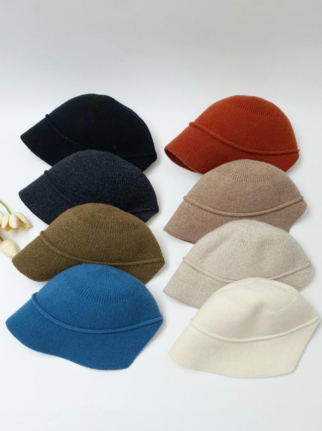 BLAIR knit hat collection: eight soft, casual winter hats in black, charcoal, olive, blue, rust, tan, beige, and cream. Comfortable bucket hat style.