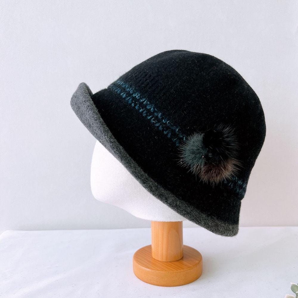 Black wool my first lady hat with gray brim, subtle blue stitching, and a charming pompom detail
