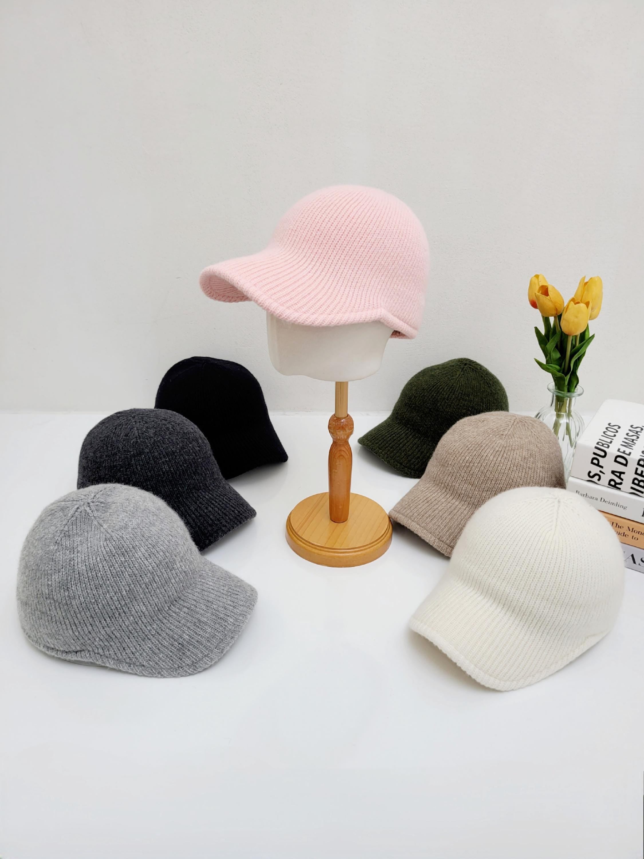 Ribbed cap collection: knitted hats in pink, black, gray, olive, beige, and white. Stylish and cozy headwear.