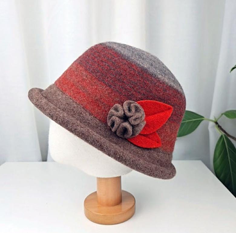 Kelly hat: Gradient brown, red, and grey felt hat with felt flower and leaf detail. Stylish and warm.