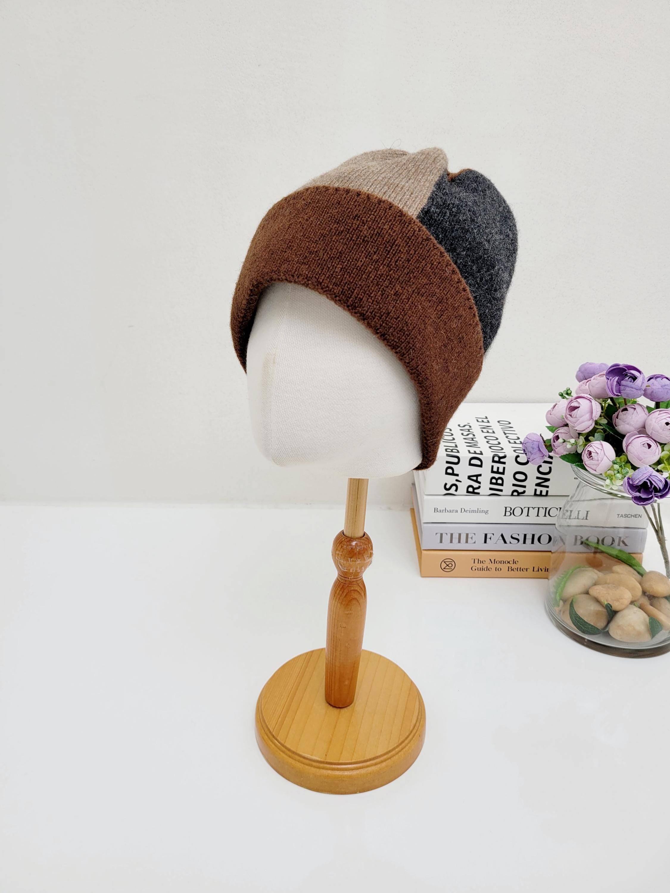Color block wool beanie in brown, tan, and charcoal gray. Stylish and warm winter hat displayed on a mannequin head.