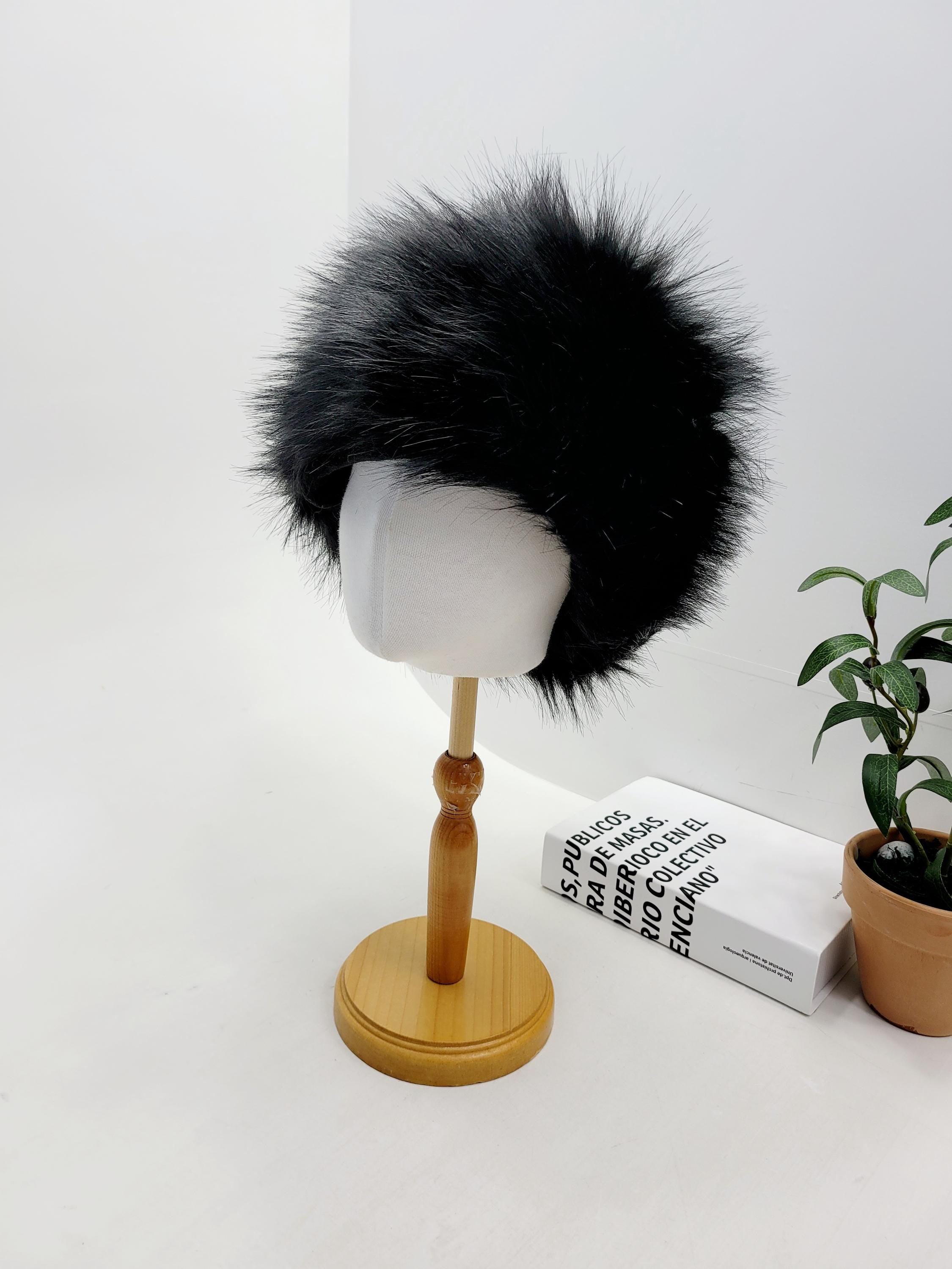 Black sonya hat fluffy, a stylish faux fur headwear, displayed on a mannequin stand