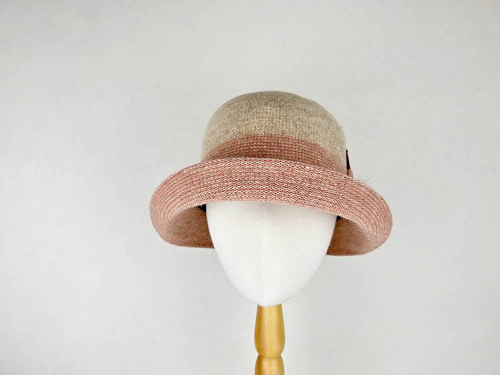 Tan and peach catherine cloche hat with a rolled brim, displayed on a mannequin head.