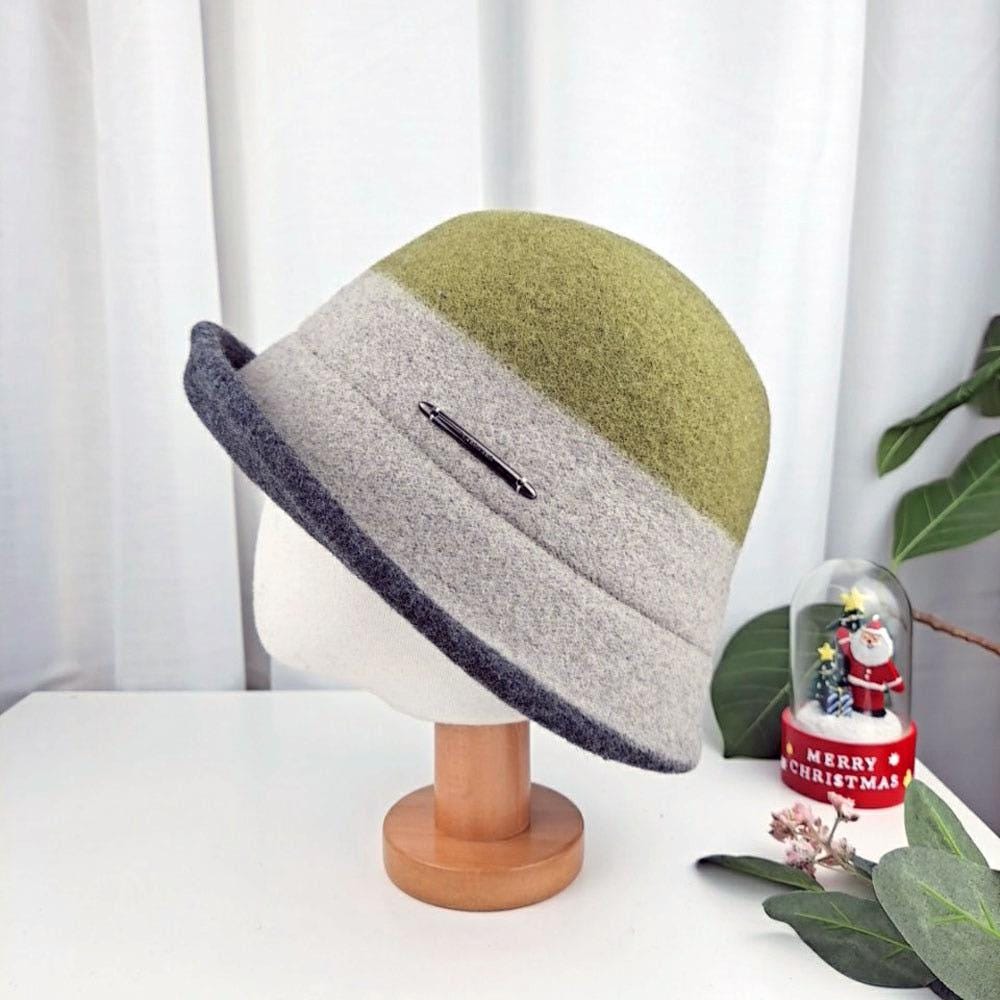 Stylish 3tone wool bucket hat: olive crown, grey band with pin detail, navy brim. Chic and warm.